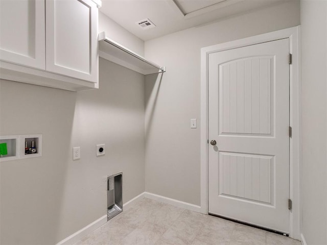 laundry area with electric dryer hookup, cabinets, and washer hookup