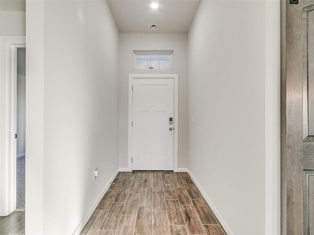 doorway with wood-type flooring