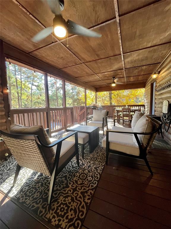 sunroom / solarium with ceiling fan