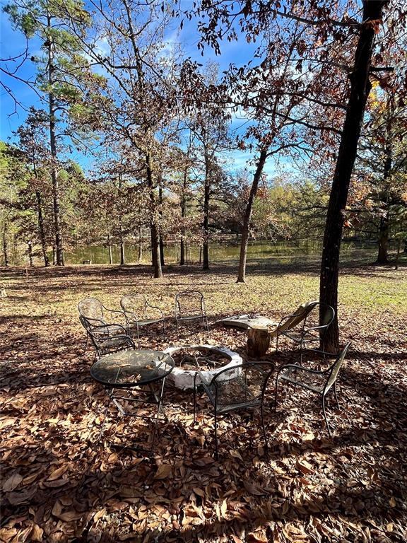 view of yard with an outdoor fire pit