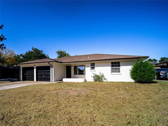 single story home with a garage and a front yard