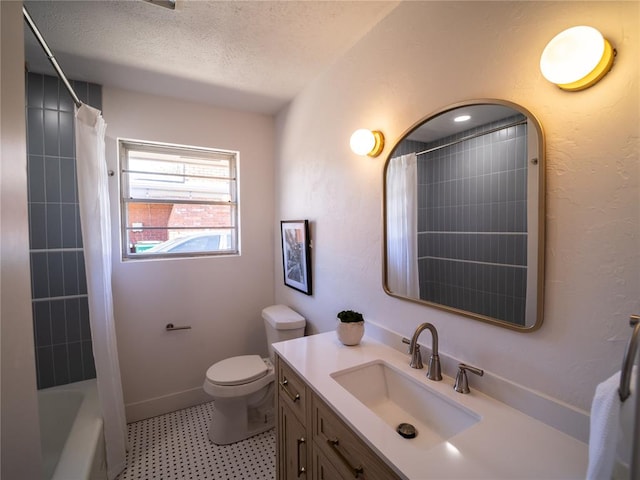 full bathroom featuring vanity, shower / bath combo, a textured ceiling, and toilet