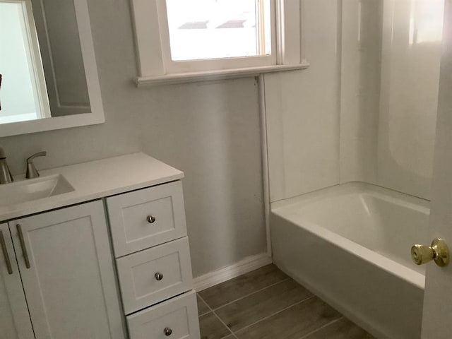 bathroom featuring tile patterned flooring, vanity, and shower / bath combination