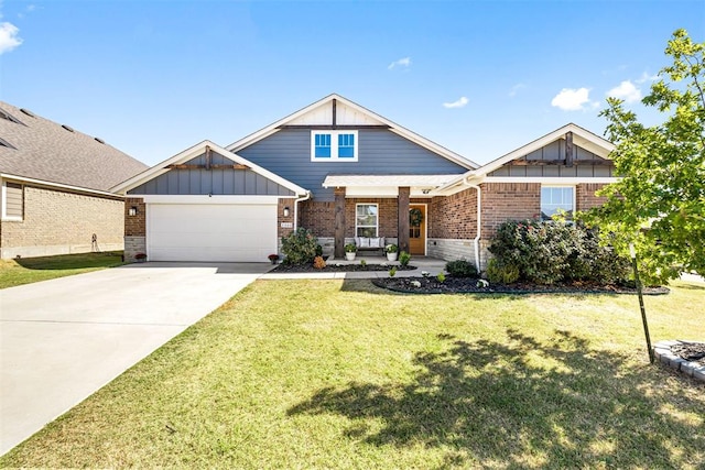 view of front of house with a front yard and a garage