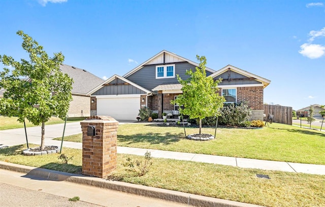 craftsman house featuring a garage and a front lawn