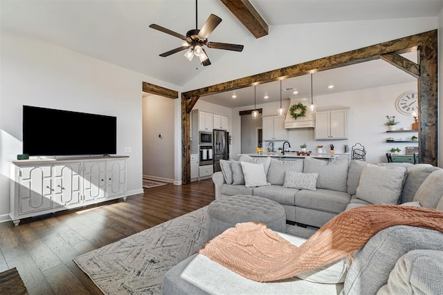 living room featuring lofted ceiling with beams, ceiling fan, dark wood-type flooring, and sink