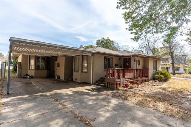 ranch-style house featuring a carport