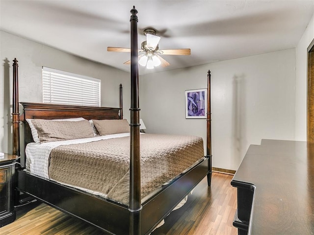 bedroom featuring ceiling fan and wood-type flooring