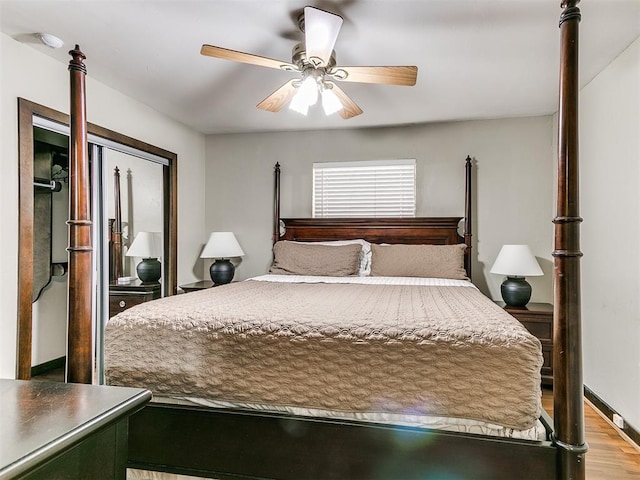 bedroom with a closet, ceiling fan, and light hardwood / wood-style flooring