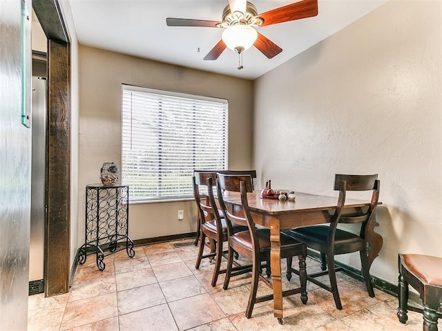 dining room with ceiling fan