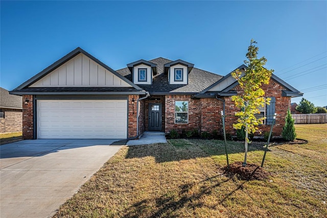 view of front facade featuring a front lawn and a garage