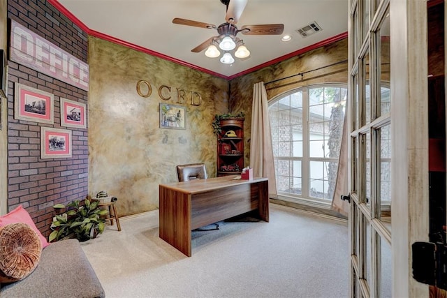 carpeted home office with ceiling fan, ornamental molding, and french doors