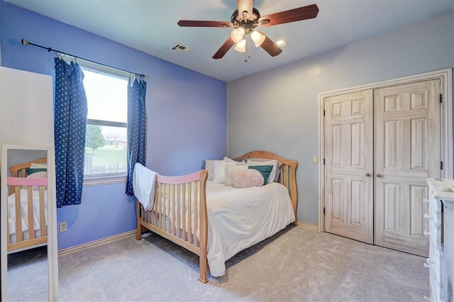 carpeted bedroom featuring ceiling fan