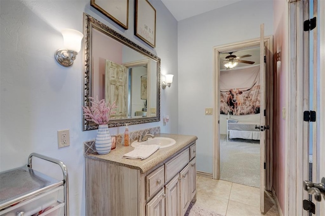 bathroom featuring tile patterned flooring, vanity, and ceiling fan