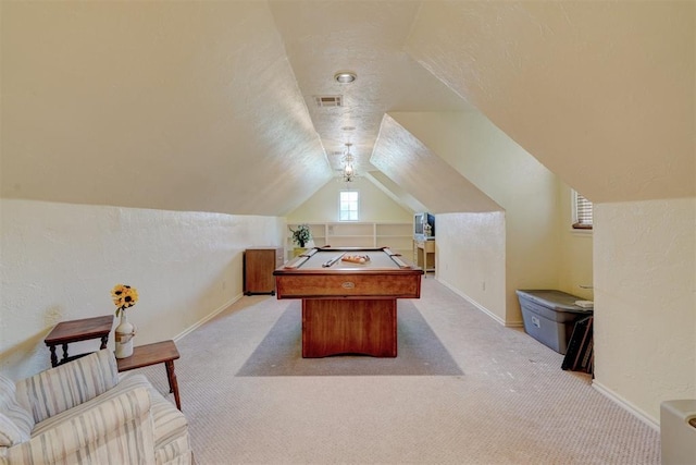 rec room with a textured ceiling, lofted ceiling, light carpet, and pool table