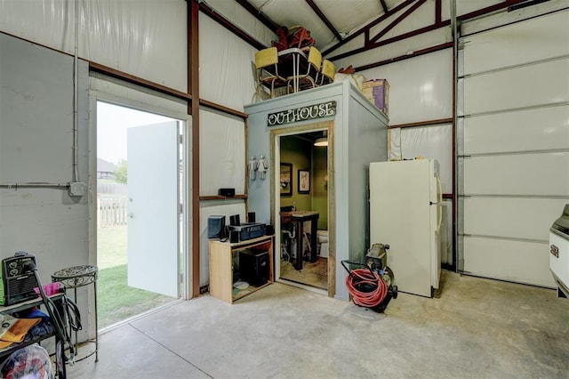 garage with white fridge