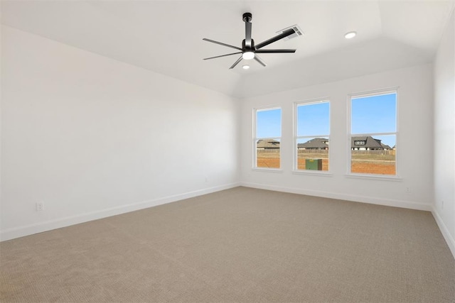 empty room featuring ceiling fan, baseboards, vaulted ceiling, light carpet, and recessed lighting