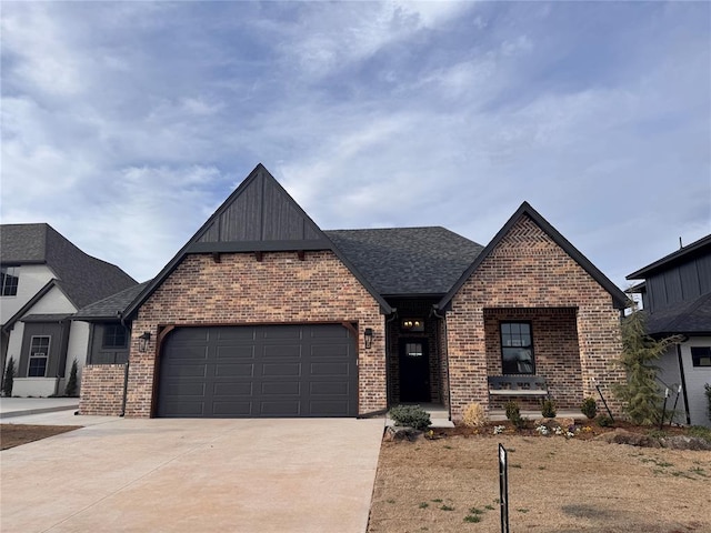 view of front of home featuring brick siding, concrete driveway, a garage, and roof with shingles