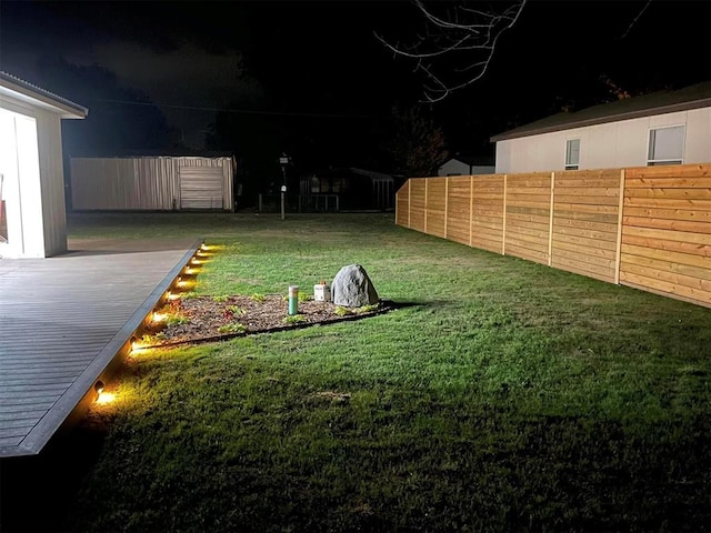 view of yard at night