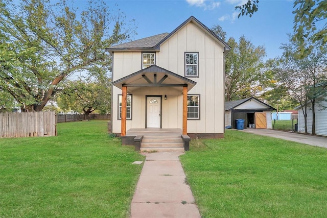 modern farmhouse with a front yard and an outbuilding