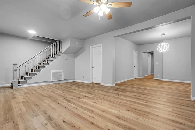 unfurnished living room with ceiling fan and light hardwood / wood-style floors