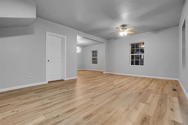 empty room featuring light hardwood / wood-style flooring and ceiling fan