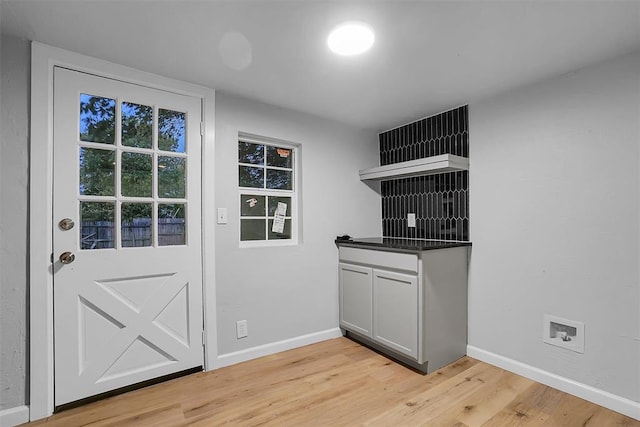 doorway to outside with light wood-type flooring