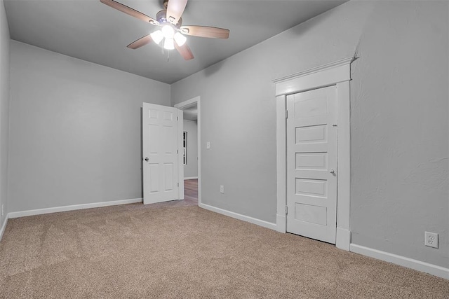 unfurnished bedroom with carpet and ceiling fan