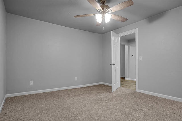 carpeted empty room with ceiling fan