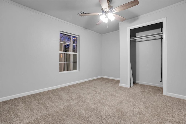 unfurnished bedroom with light carpet, a closet, ceiling fan, and ornamental molding