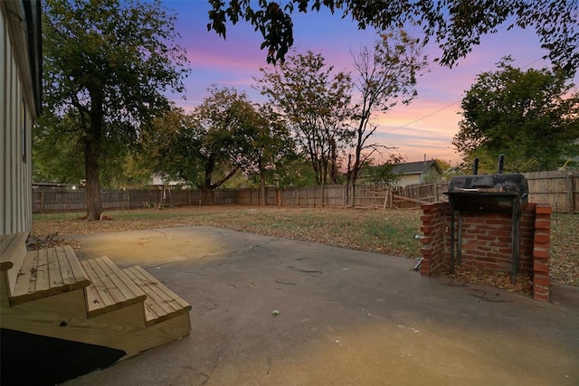 view of patio terrace at dusk