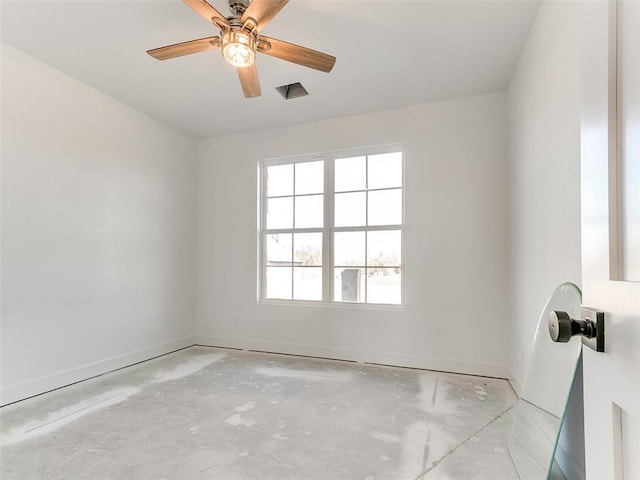 empty room with ceiling fan, baseboards, and unfinished concrete flooring