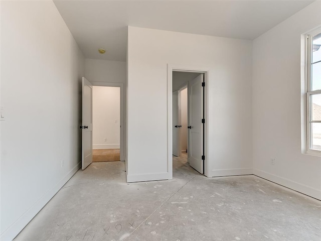 unfurnished bedroom with baseboards