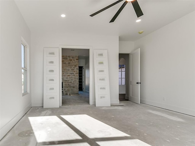 unfurnished bedroom featuring ceiling fan, baseboards, and recessed lighting