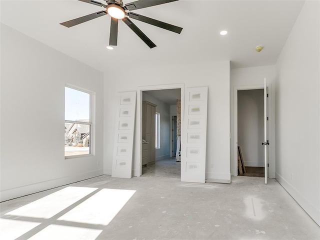 unfurnished bedroom featuring a ceiling fan, recessed lighting, concrete floors, and baseboards