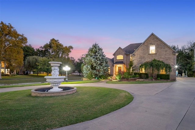 view of front of home with a yard