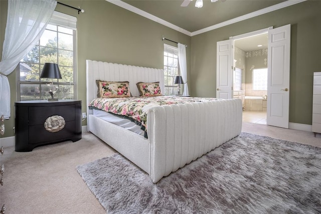 carpeted bedroom featuring ceiling fan, crown molding, and connected bathroom