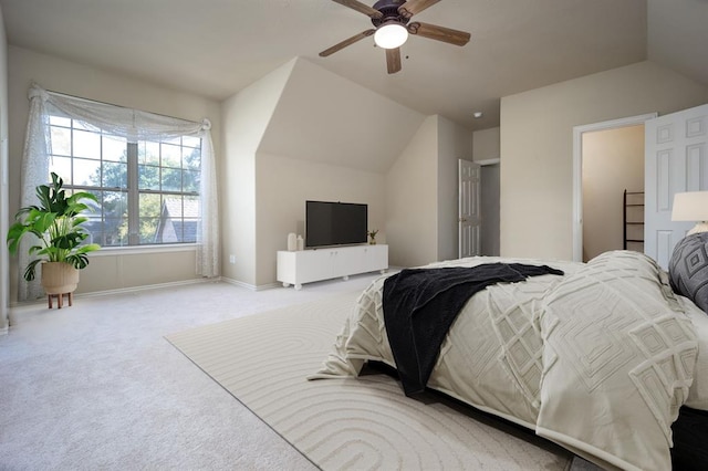 carpeted bedroom with ceiling fan and lofted ceiling