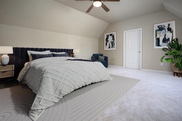 carpeted bedroom featuring vaulted ceiling and ceiling fan