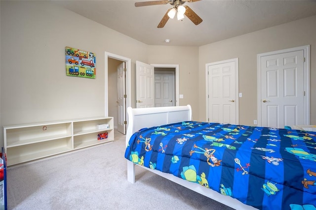 bedroom with ceiling fan and carpet