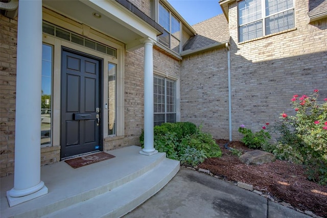 view of exterior entry featuring a porch