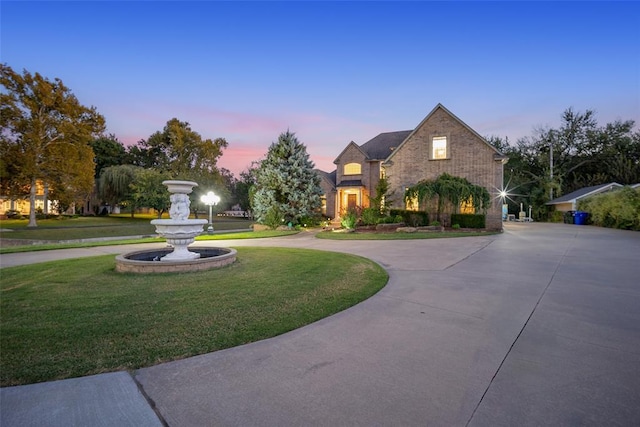 view of front of house with a lawn