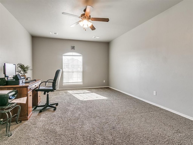 carpeted home office with ceiling fan