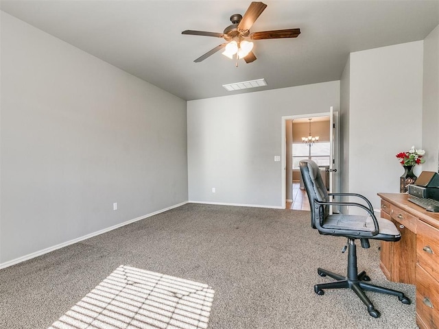 office space with carpet and ceiling fan with notable chandelier