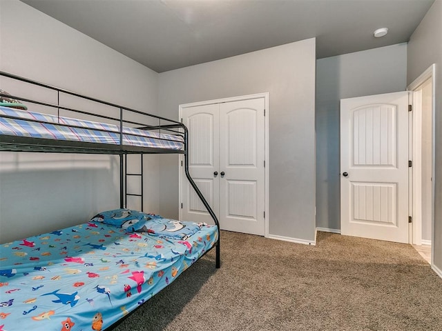 bedroom with a closet and carpet