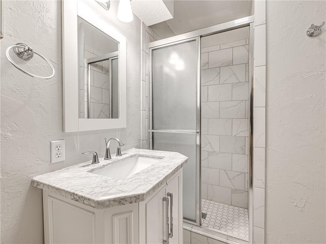 bathroom with vanity and walk in shower