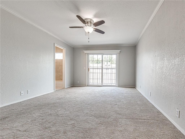 carpeted spare room featuring crown molding, ceiling fan, and a textured ceiling