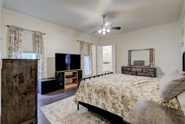 bedroom with multiple windows, dark hardwood / wood-style floors, ceiling fan, and ornamental molding