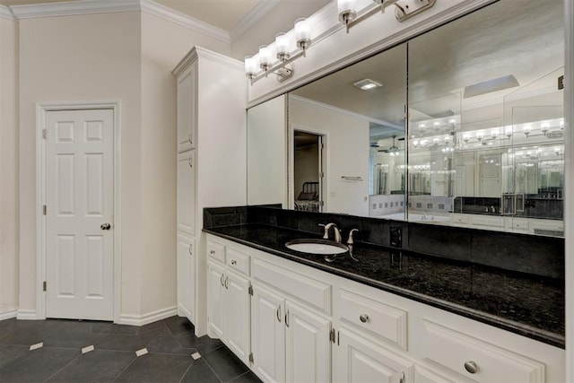 bathroom featuring tile patterned flooring, vanity, and ornamental molding