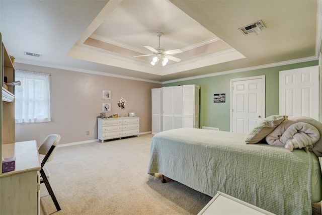 bedroom featuring light colored carpet, a raised ceiling, ceiling fan, and ornamental molding